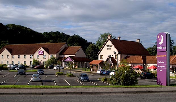 Exterior of Premier Inn Hotel Falkirk East showing car park